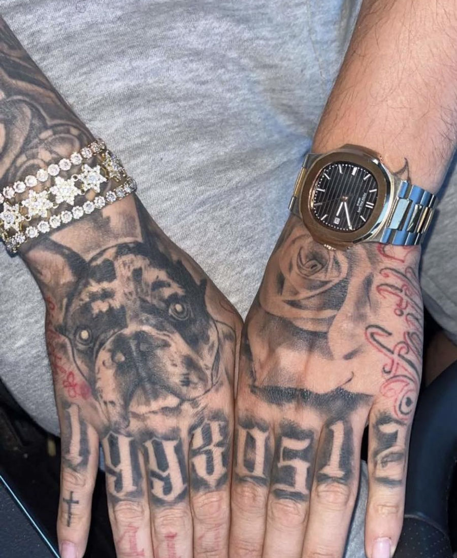Black and grey bulldog and rose hand tattoos