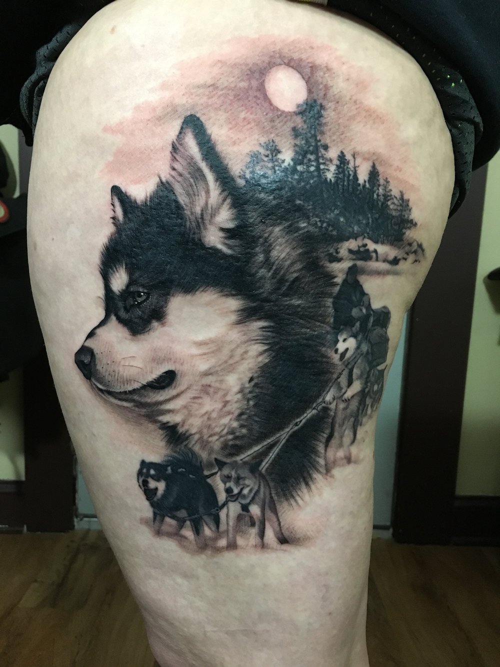 Husky and sled dogs scene tattoo by Bill Byers, Worcester MA