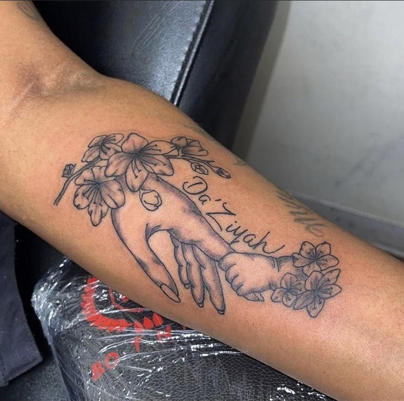 Floral praying hands fine line tattoo with name