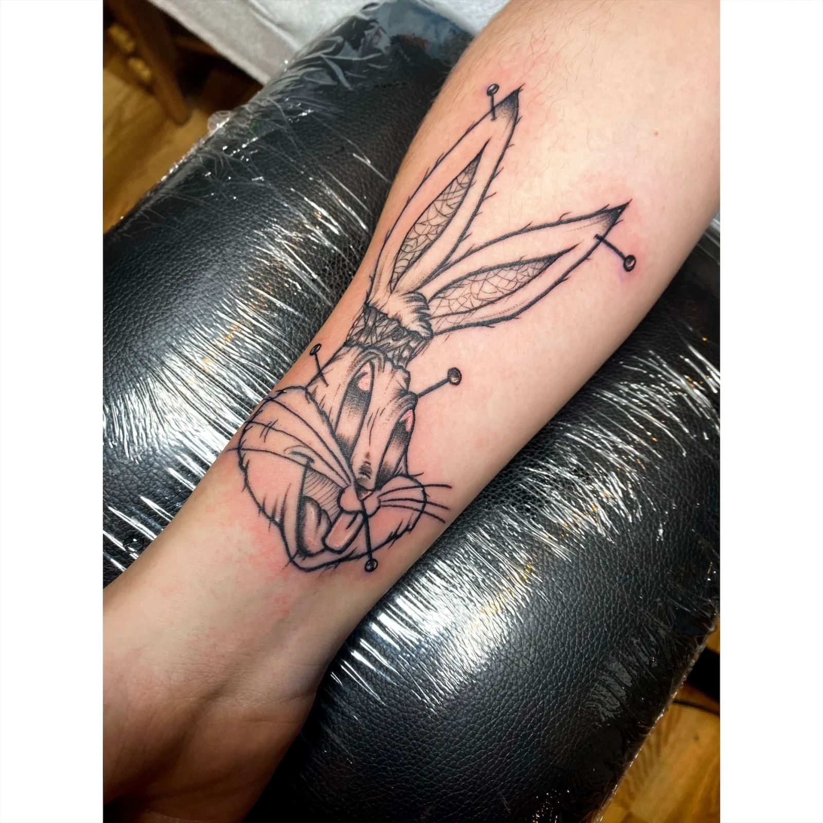 Black and grey character forearm
