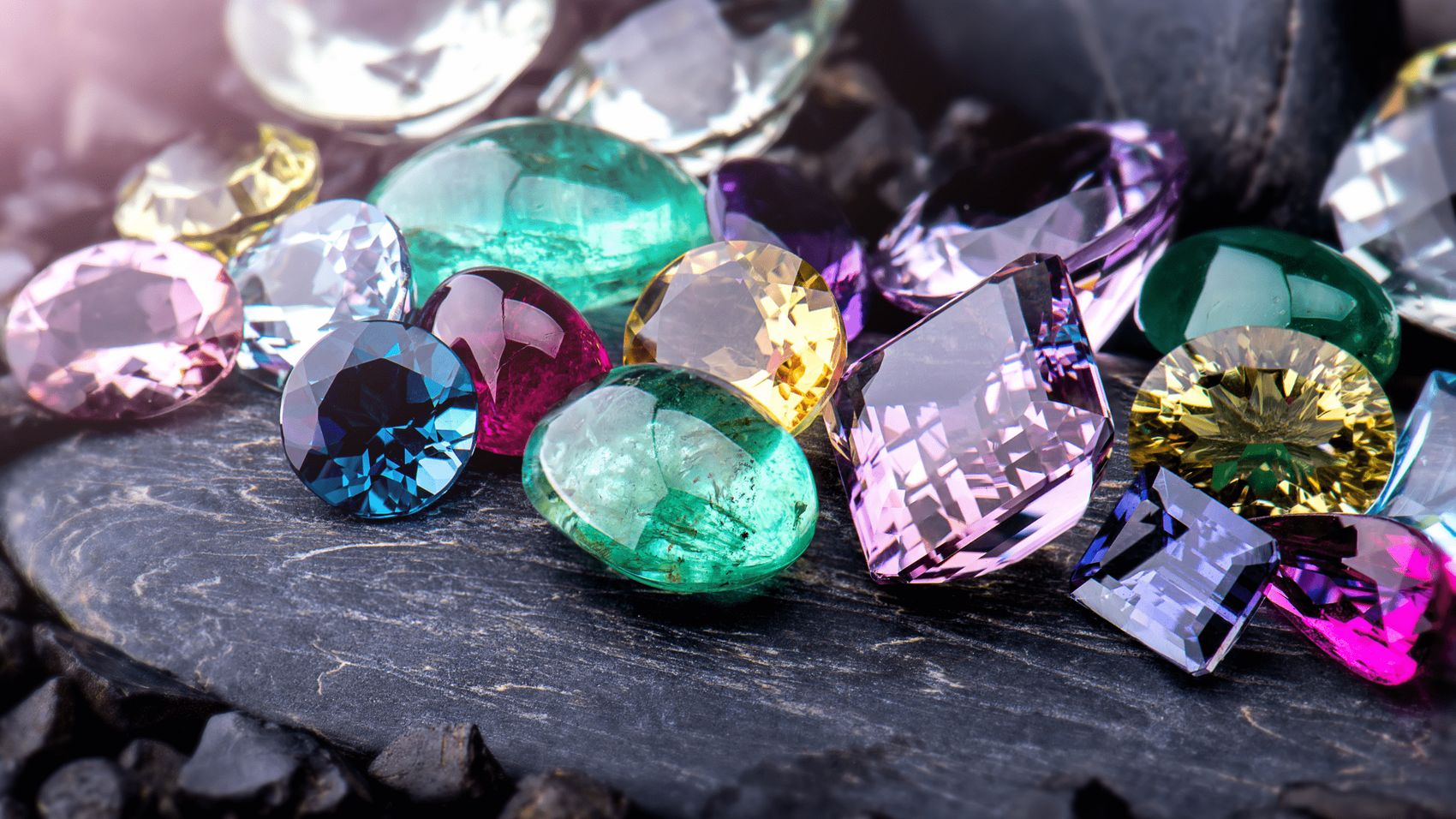 A spread of rare loose gemstones in many colors