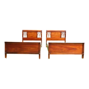 A pair of mahogany twin headboards with pierced detail