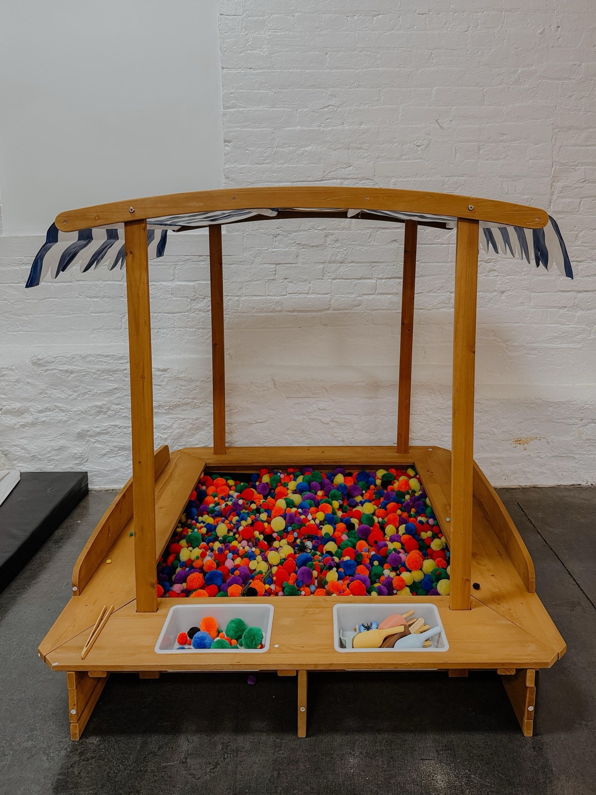 The pom-pom sensory pit set up for a party at Green Elephant