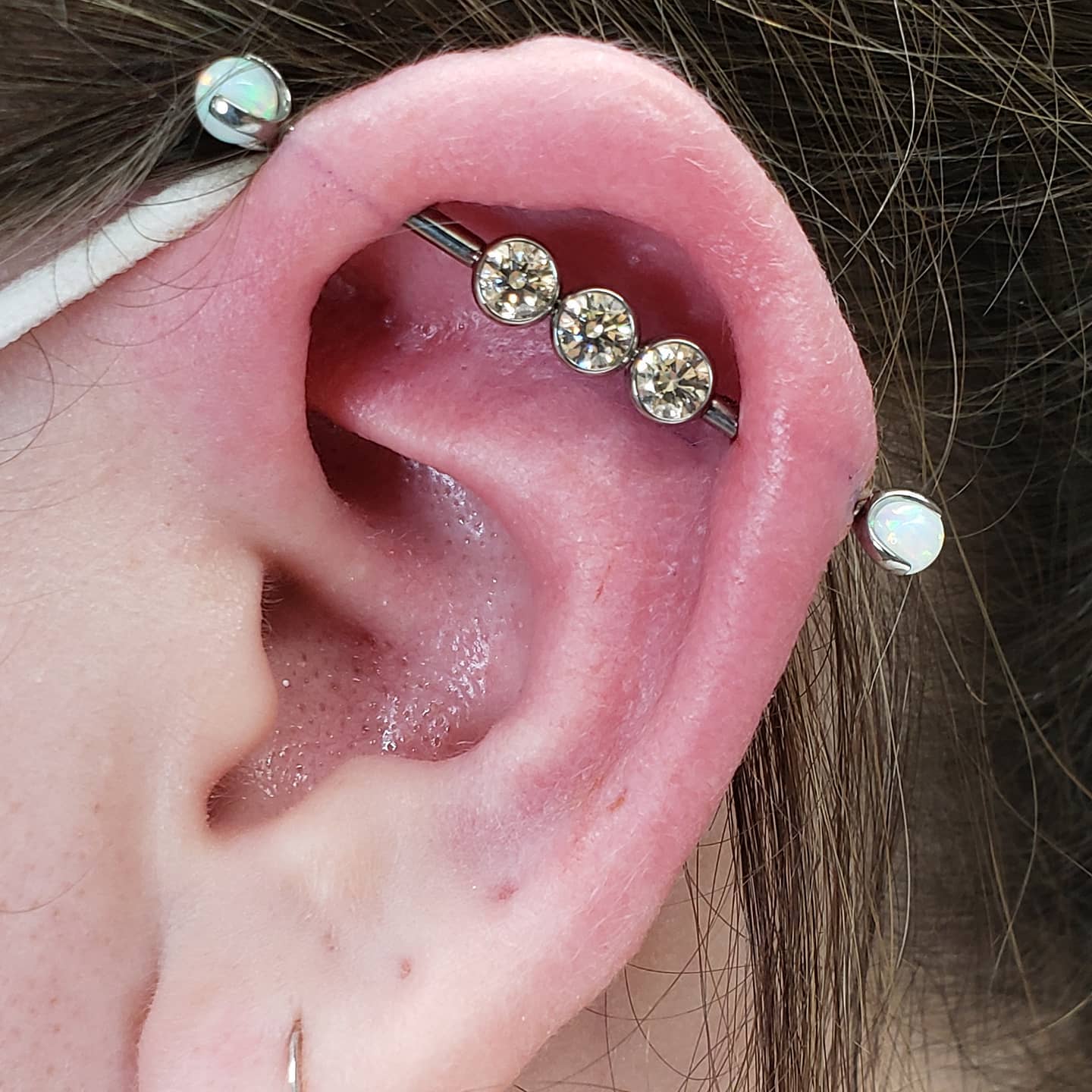 Industrial barbell with three gems and opal ends
